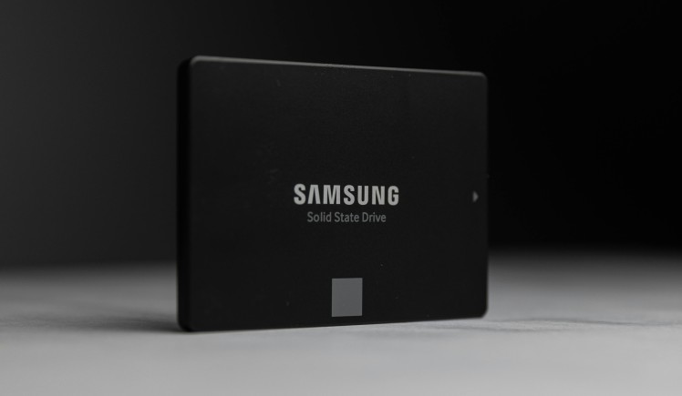 SATA SSD lying flat on a dark background