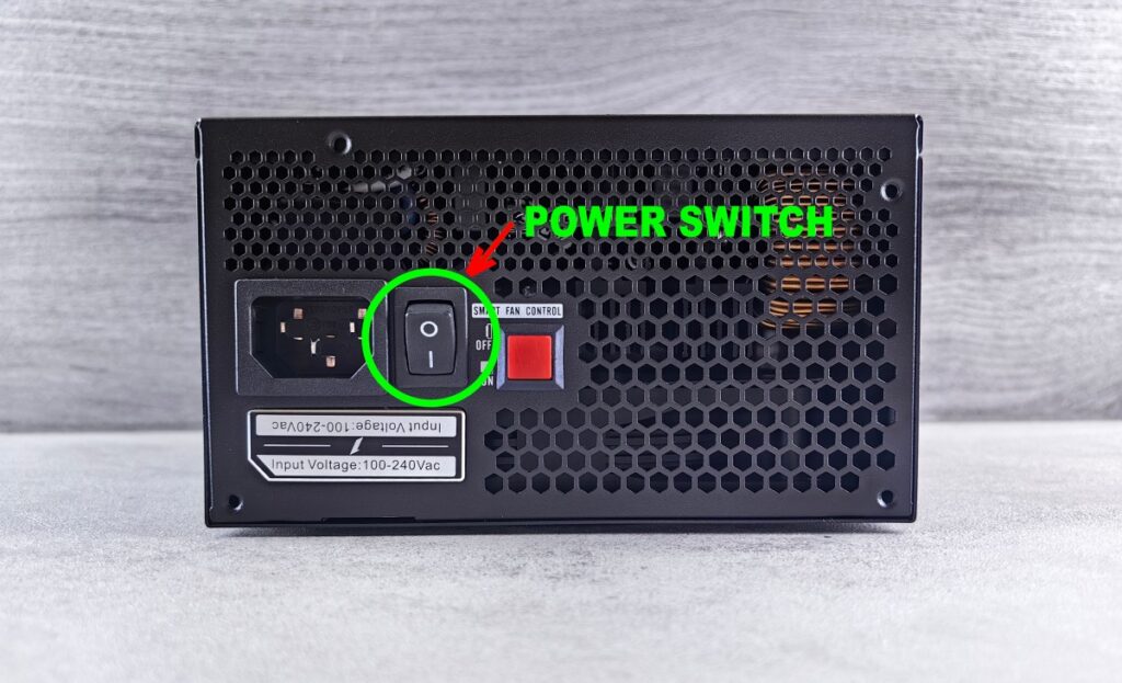 PC power supply with arrows showing the rear PSU power switch