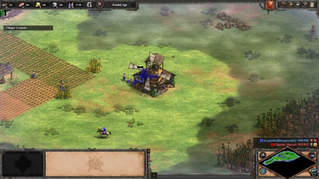 Age of Empires II Definitive Edition battle with armies and buildings