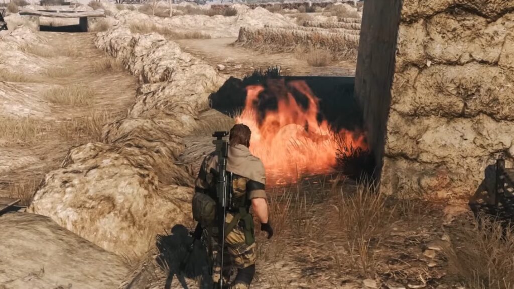 Snake approaching an enemy base in Metal Gear Solid V The Phantom Pain