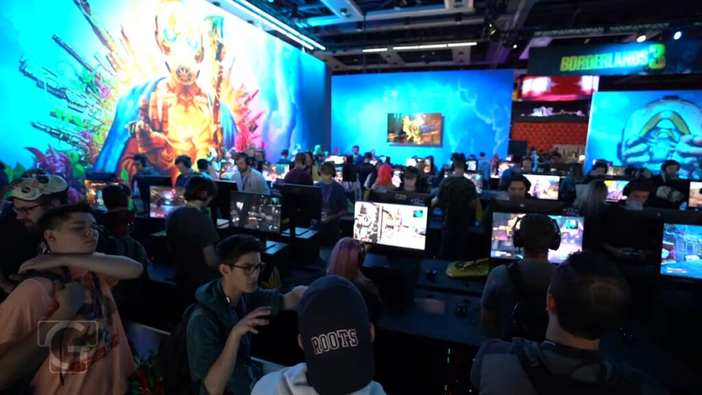 Online Games for Low End PCs - Crowded gaming convention floor filled with PC gamers, esports booths, and multiplayer game showcases